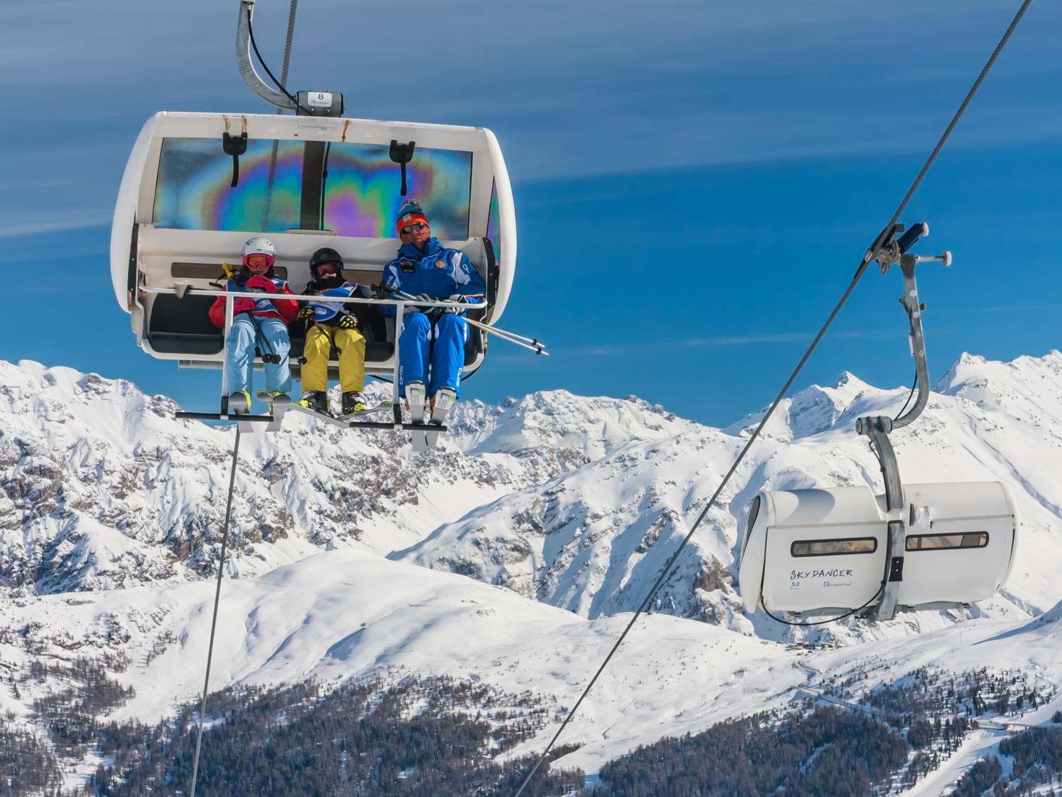 Skiers on a chair lift