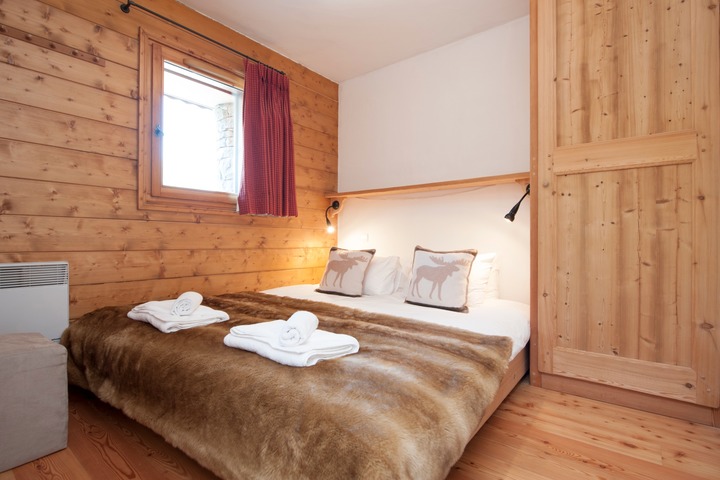 The master double bedroom offers good storage space and views across the resort