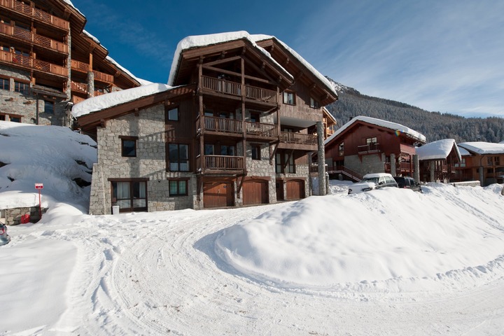 The exterior view of Chalet Cheval Blanc showing the property's three levels