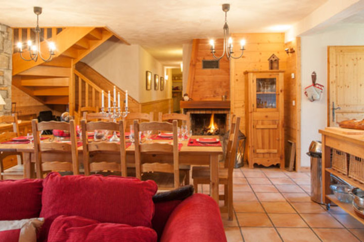 The dining area and kitchen lead off the living room, and are warmed by a cosy log fire